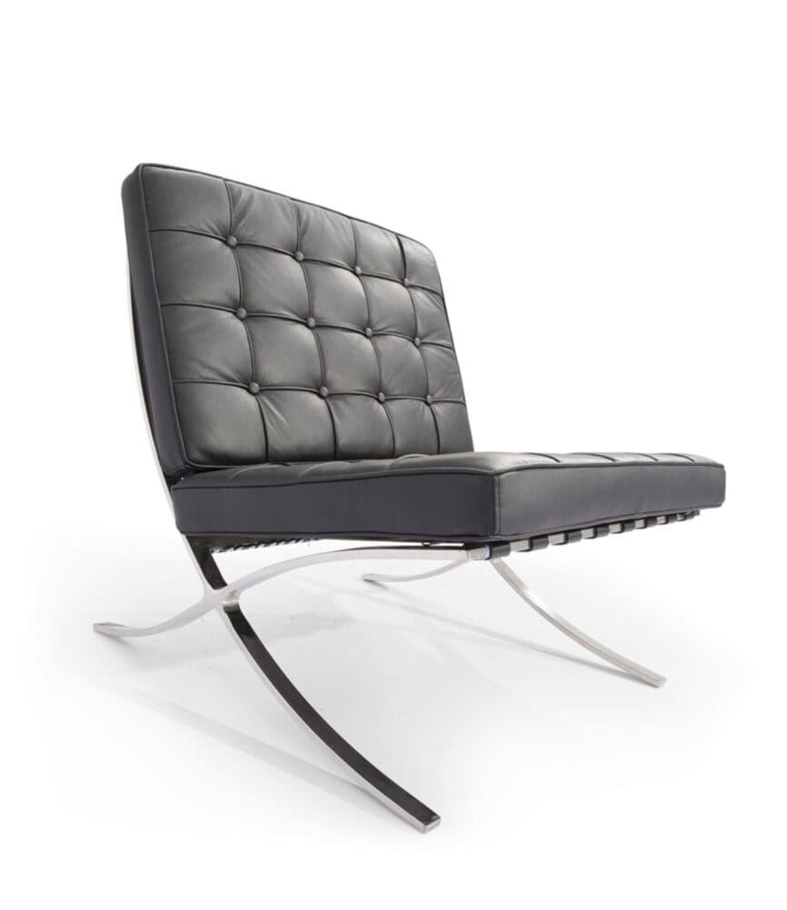 Black leather lounge chair with tufted upholstery and sleek metal frame.