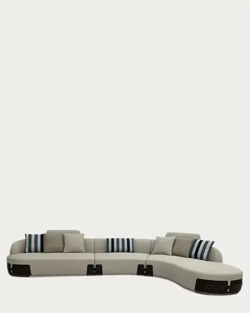 Fendi curved sectional sofa in neutral tones with striped accent pillows, stylish and comfortable fo.