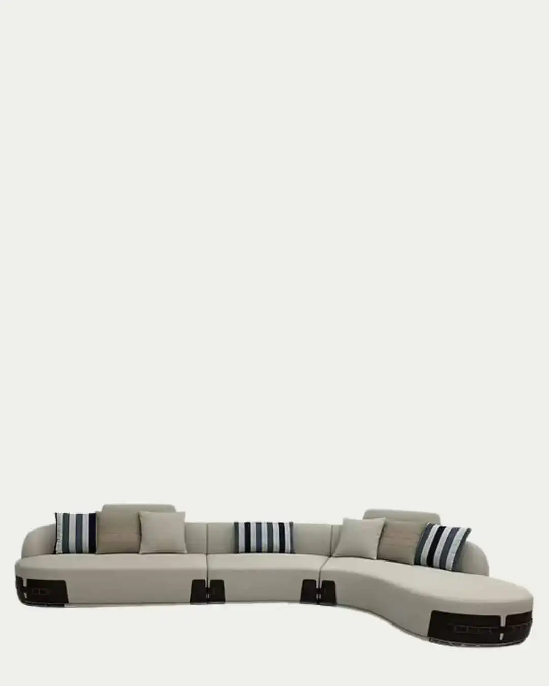 Fendi curved sectional sofa in neutral tones with striped accent pillows, stylish and comfortable fo.