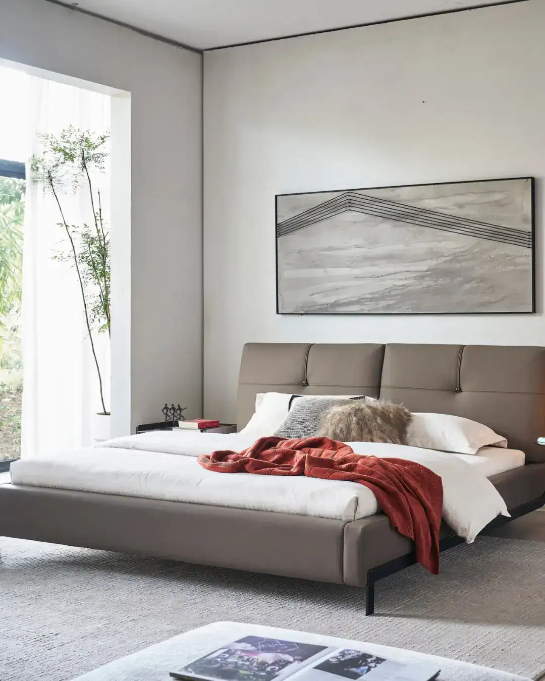 Elegant Dainty Bed with neutral tones and cozy throw blanket in modern bedroom setting.