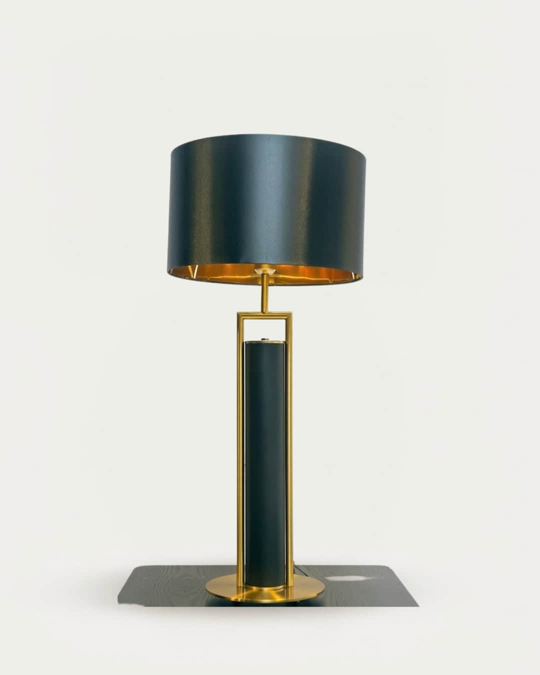 Black and gold metal table lamp with a modern design, perfect for contemporary home decor.