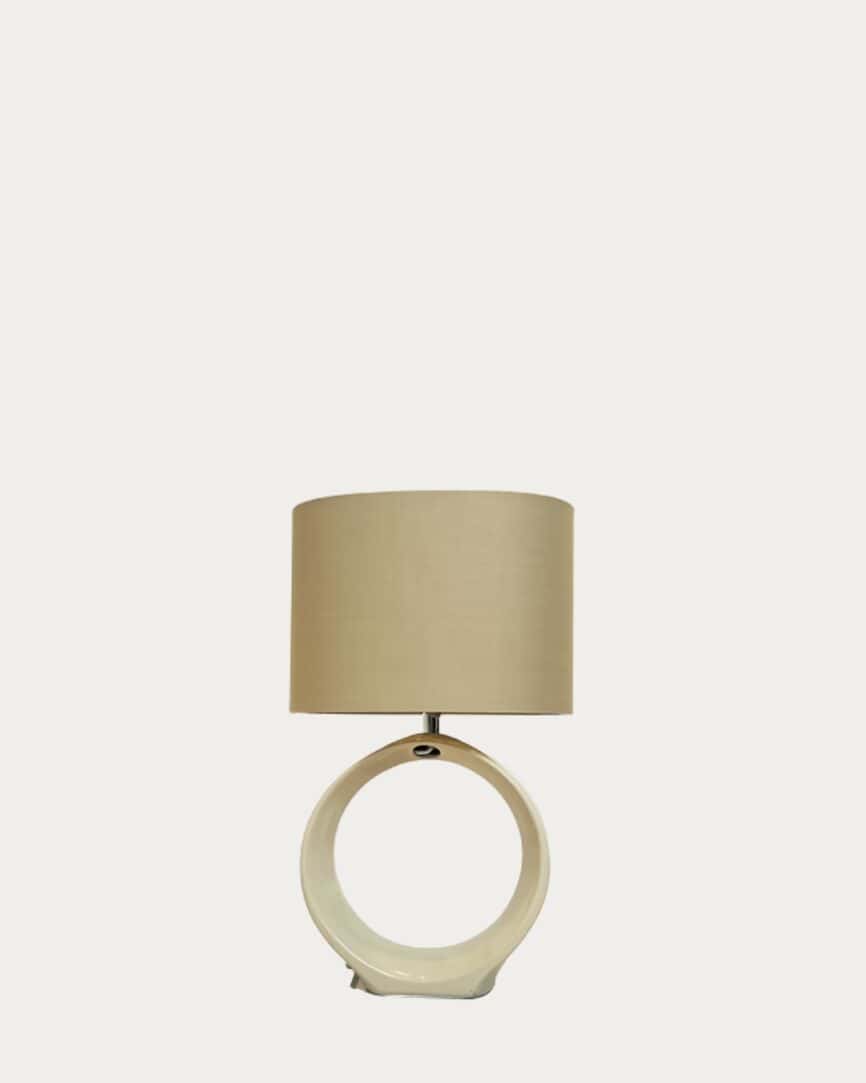 Matte white hollow cream base table lamp with modern circular design.