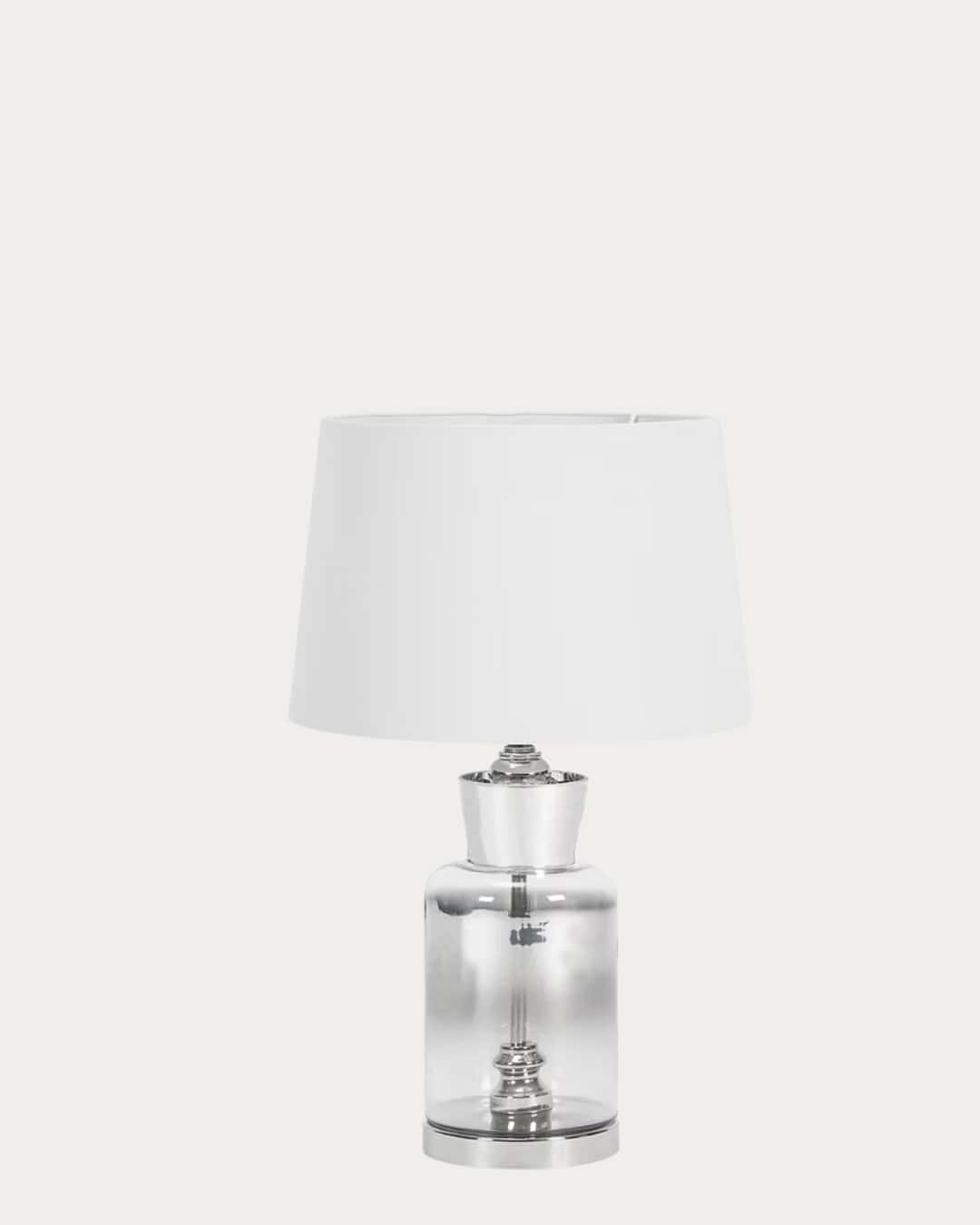 Ombre glass table lamp with white shade and clear base for modern home decor.