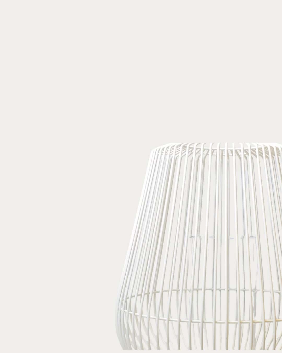 White hurricane lantern with a modern, open-frame design, perfect for outdoor or indoor decor.