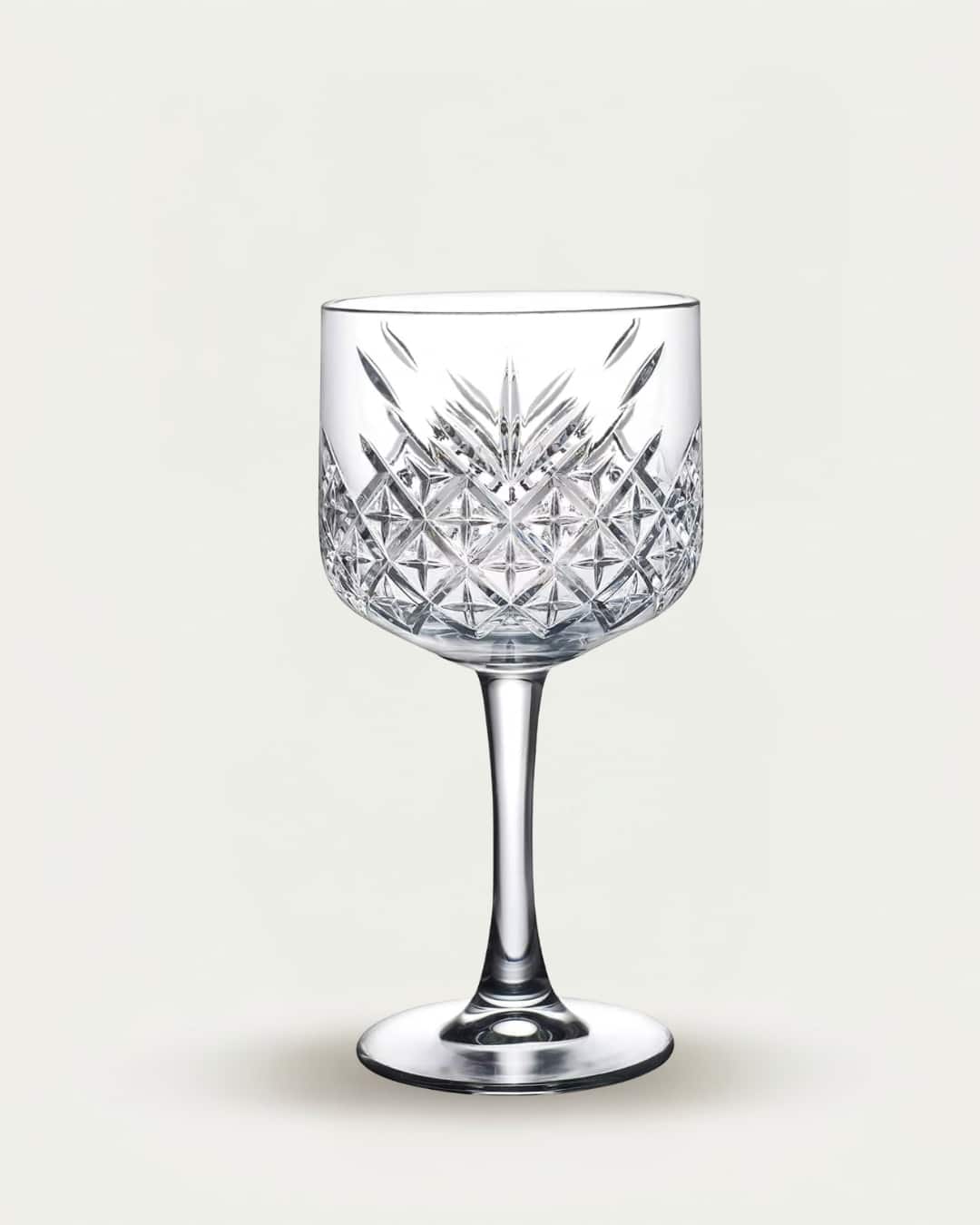 Elegant crystal whiskey glass with intricate cut patterns, perfect for sophisticated drinkware colle.