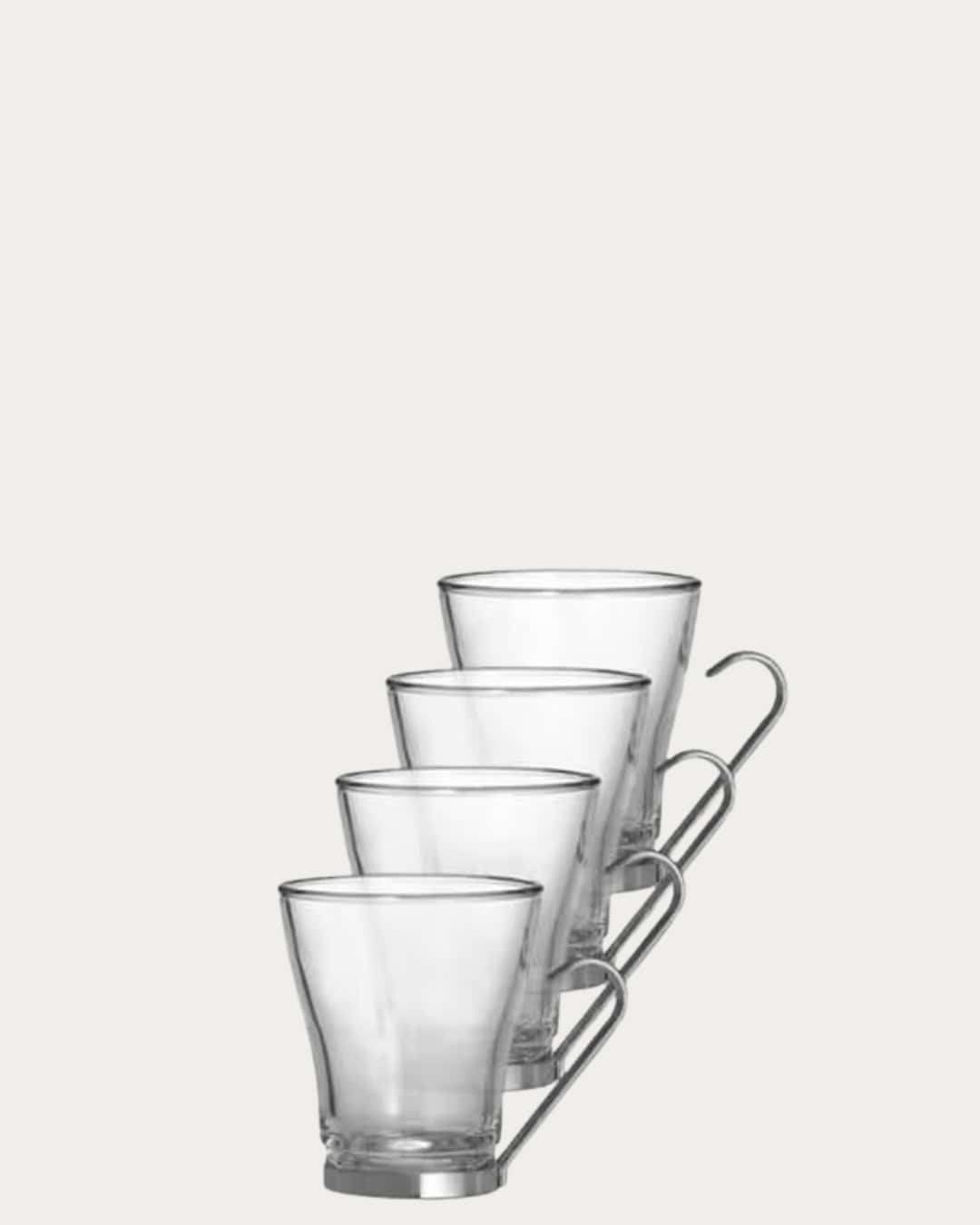 Clear glass mugs set on a metal rack, perfect for hot beverages and stylish table settings.