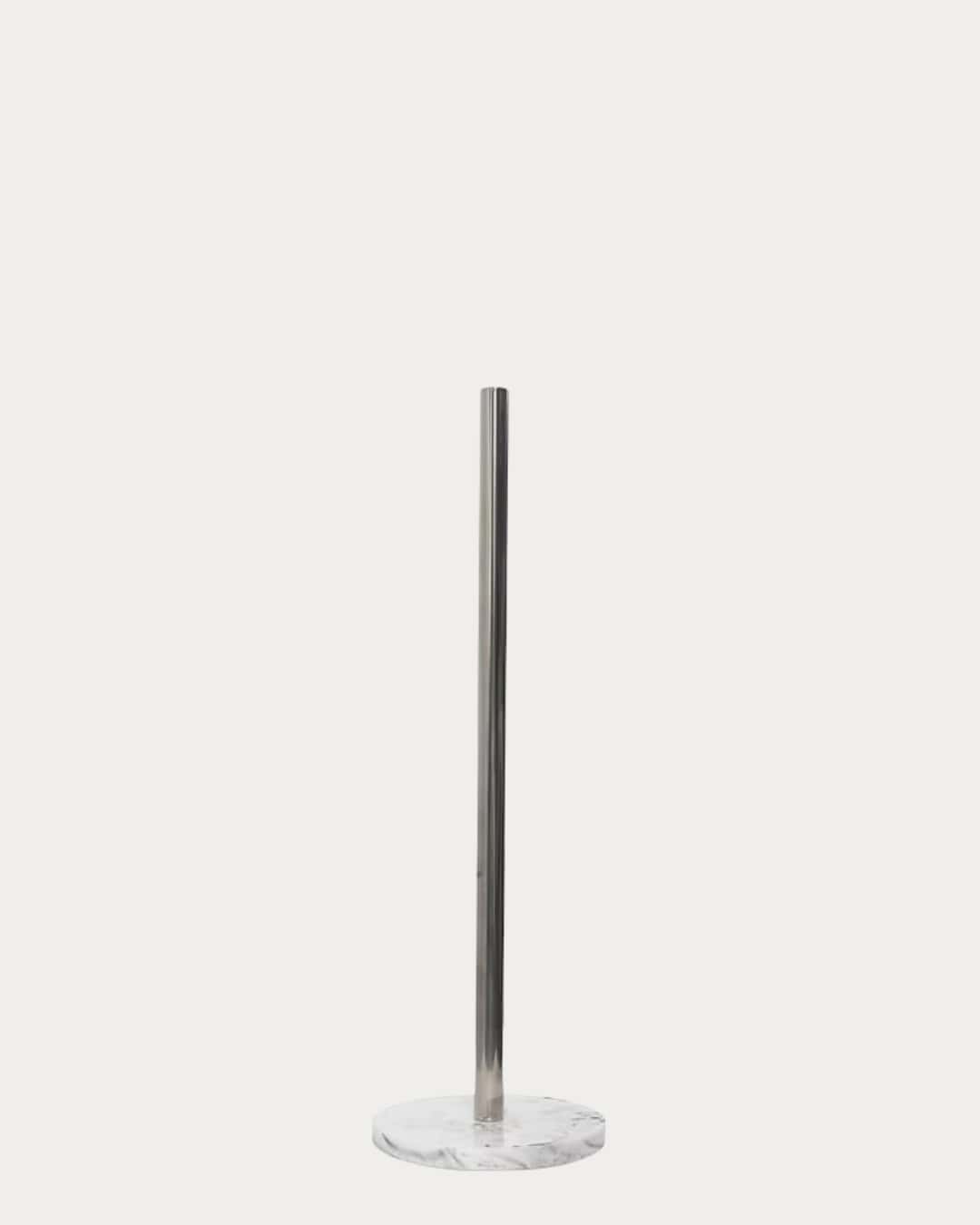 Marble effect kitchen towel holder with sleek stainless steel pole and round marble base.