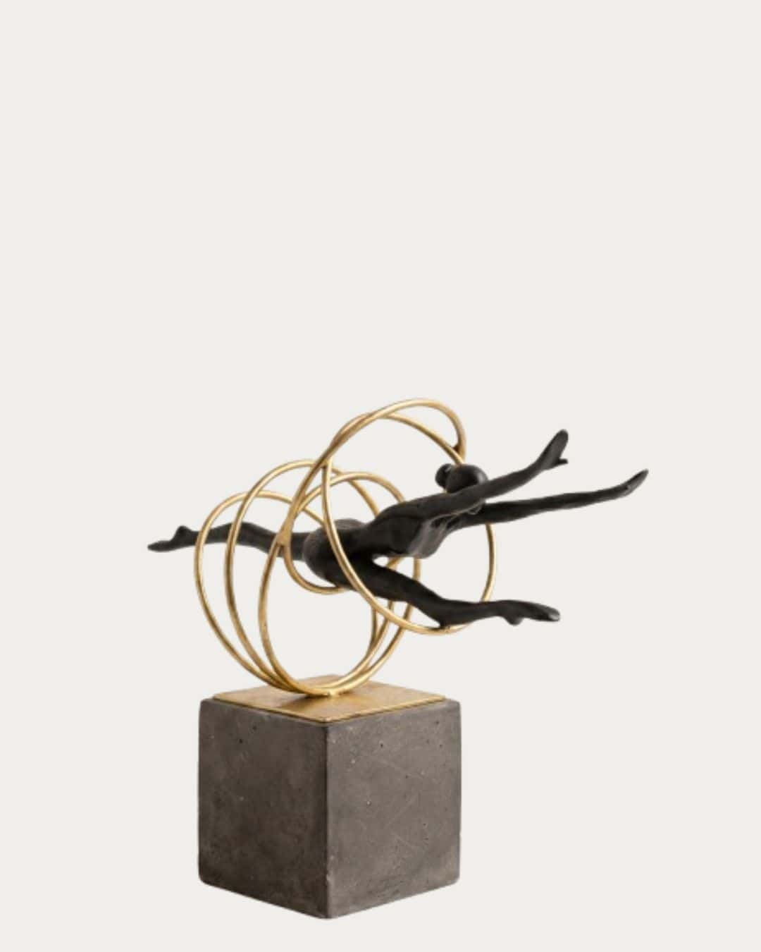 Black and Gold Gymnastic Ring Ornament on Concrete Base - Elegant Home Decor Piece.
