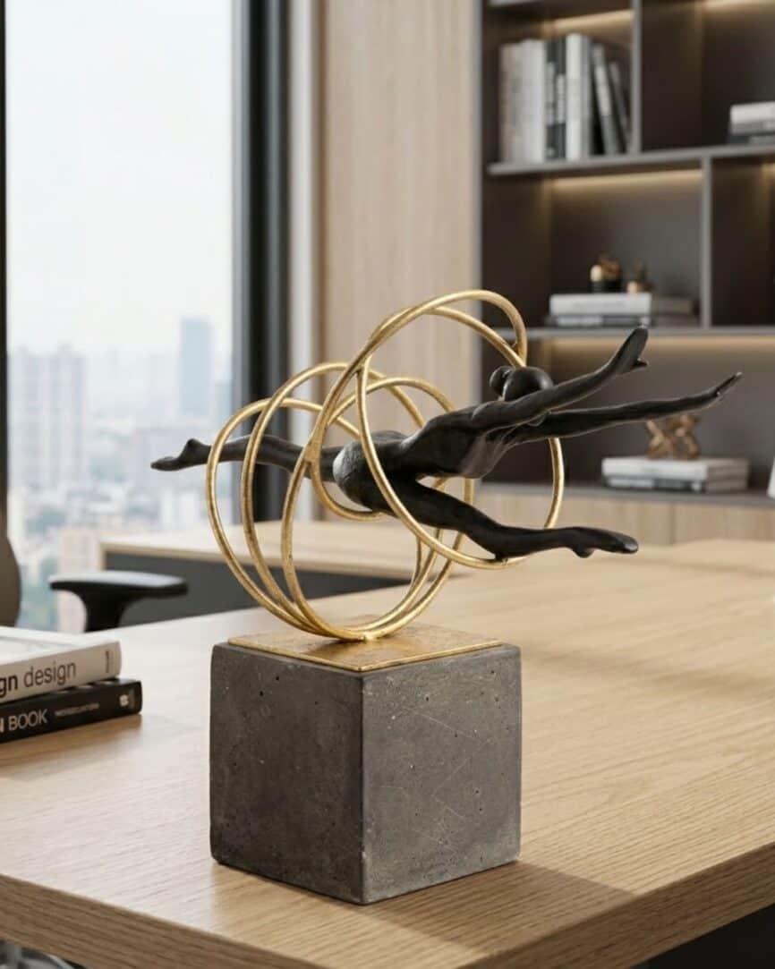 Elegant black and gold gymnastic ring ornament with circular accents on a concrete base. Perfect for.