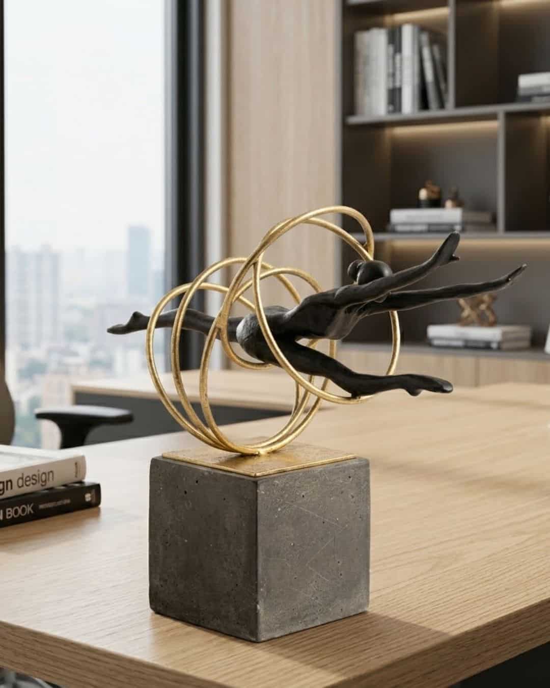 Elegant black and gold gymnastic ring ornament with circular accents on a concrete base. Perfect for.