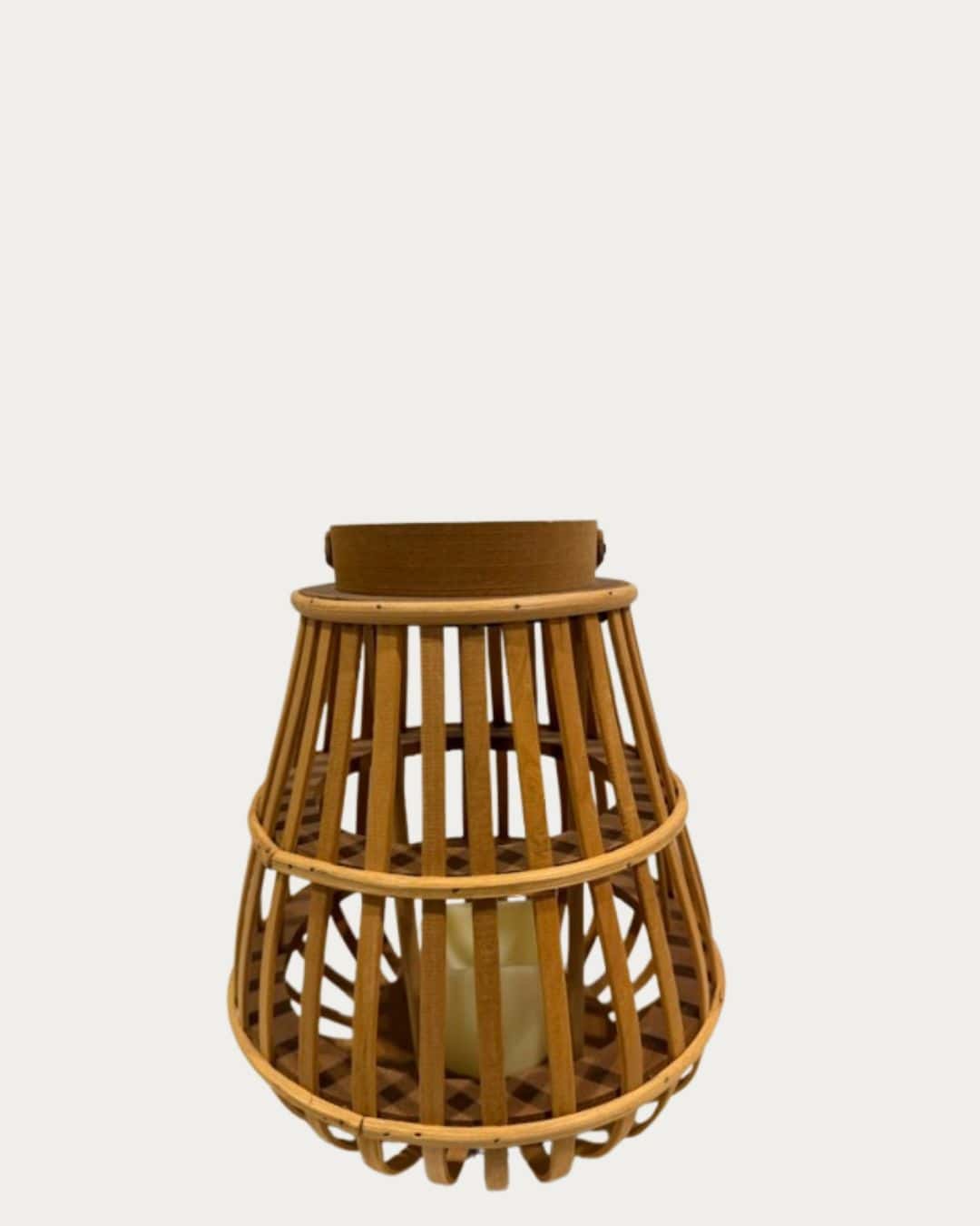 Brown rattan LED lantern with a woven design, perfect for outdoor or indoor ambient lighting.