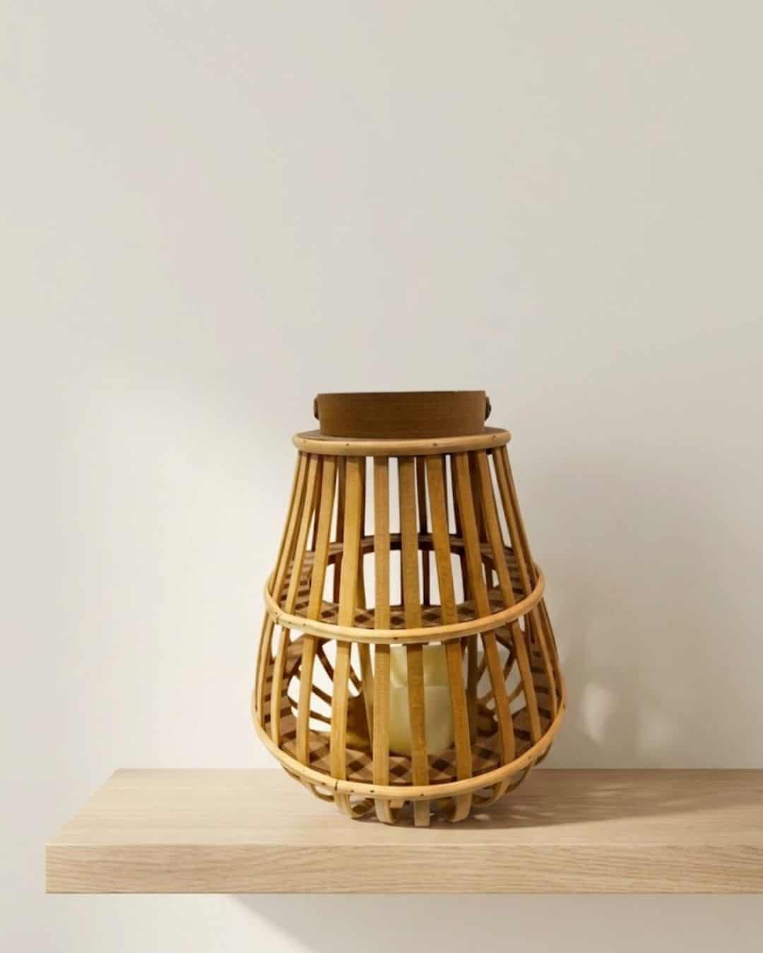Brown rattan LED lantern with a wooden top, perfect for outdoor or indoor ambient lighting.