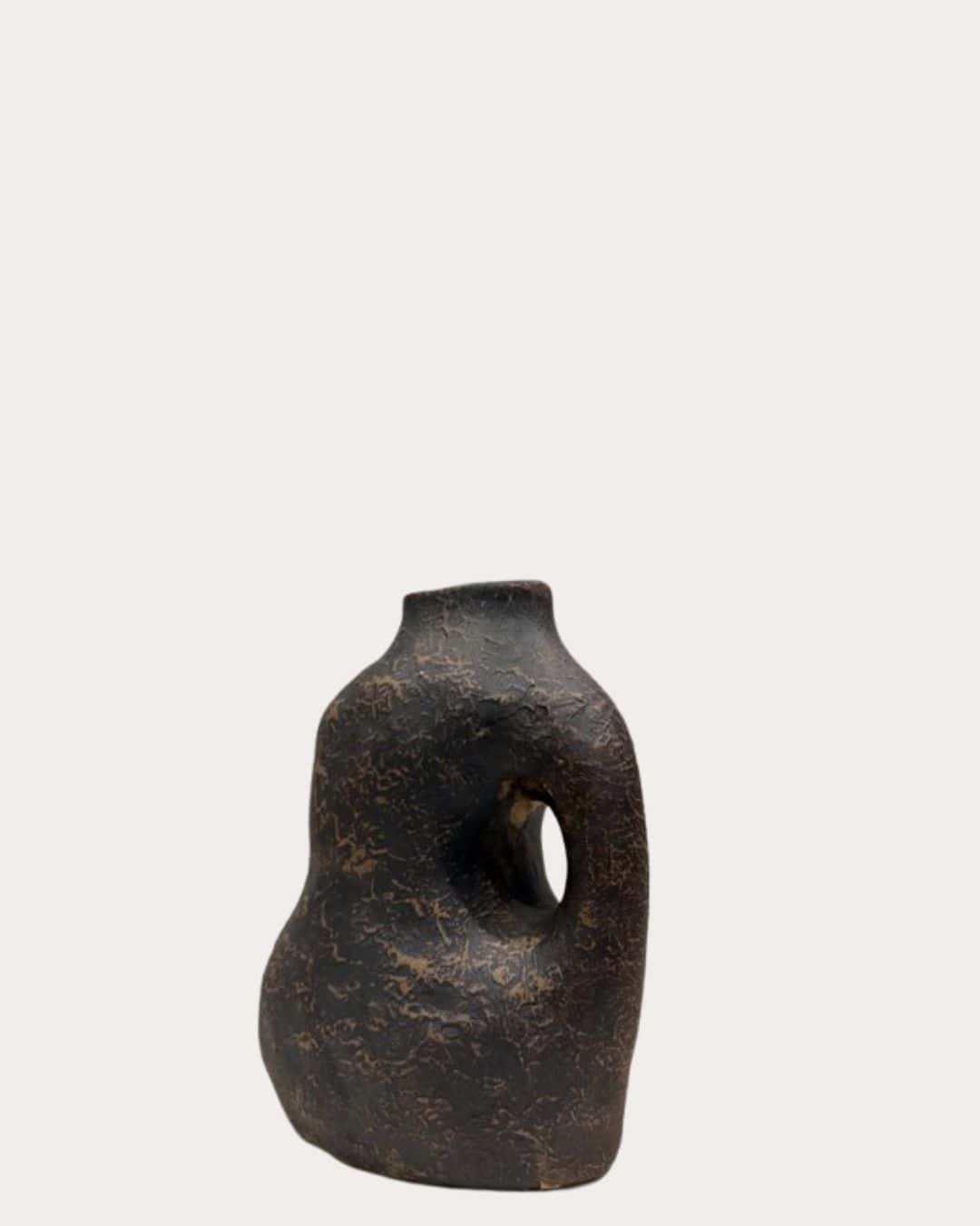 Cream and bronze textured irregular shape vase with a unique handle design, perfect for modern home.