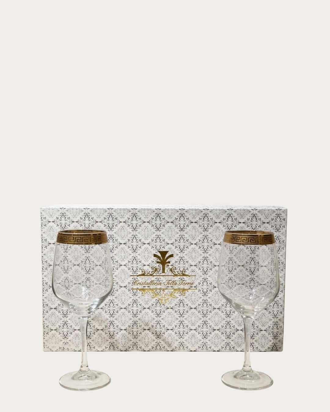 Elegant Christalleria wine glasses with gold accents, perfect for special occasions and gift sets.