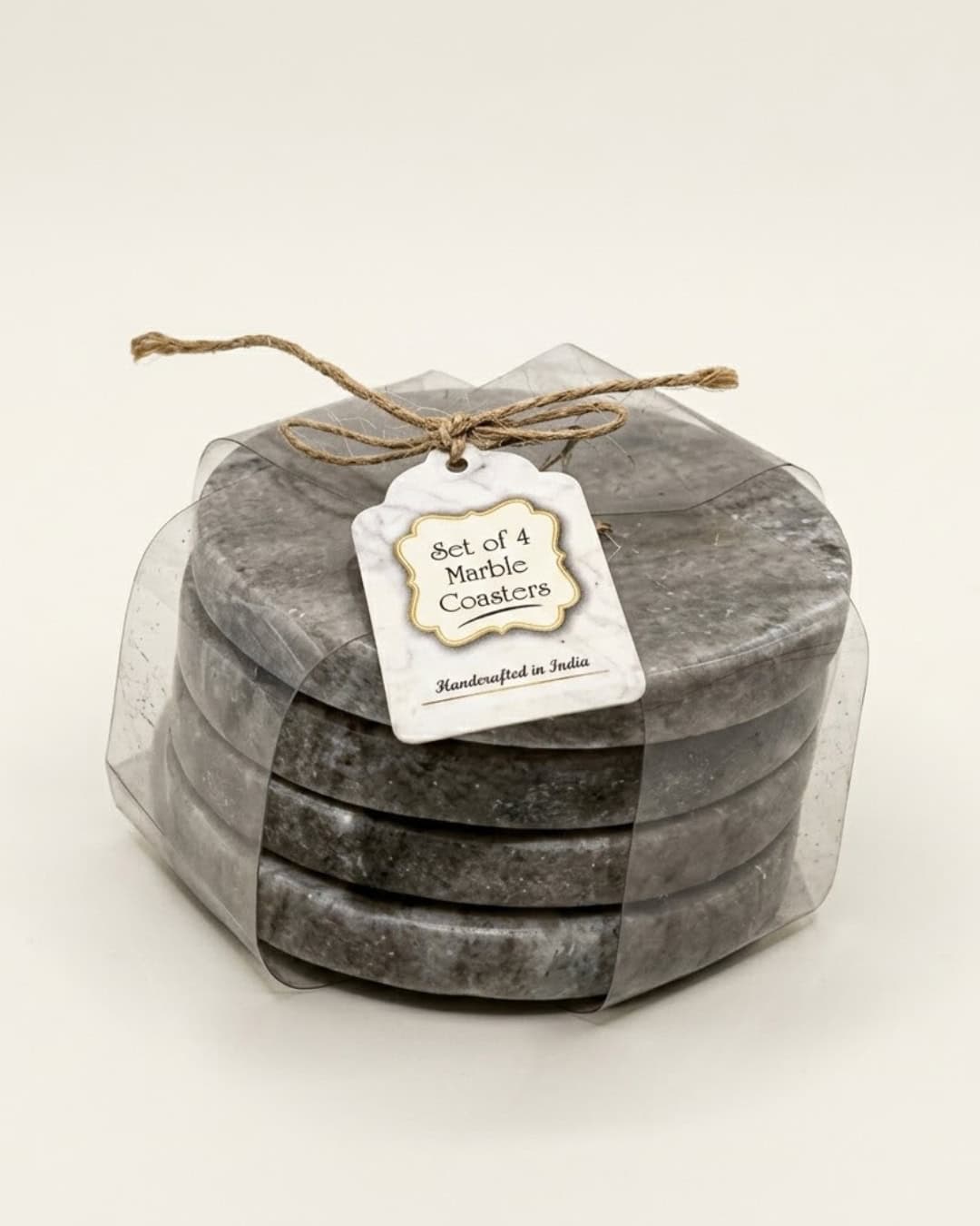 Set of 4 grey marble coasters with gold accents in a clear gift box.