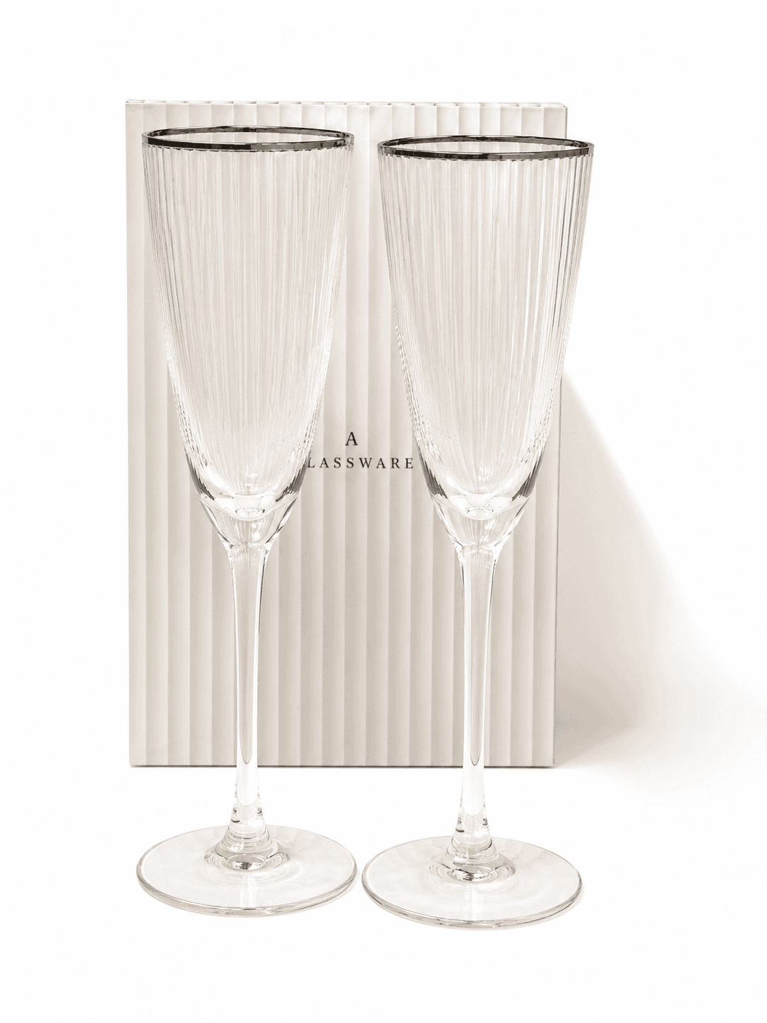 Two elegant silver-rim tall deco champagne flutes for special occasions.