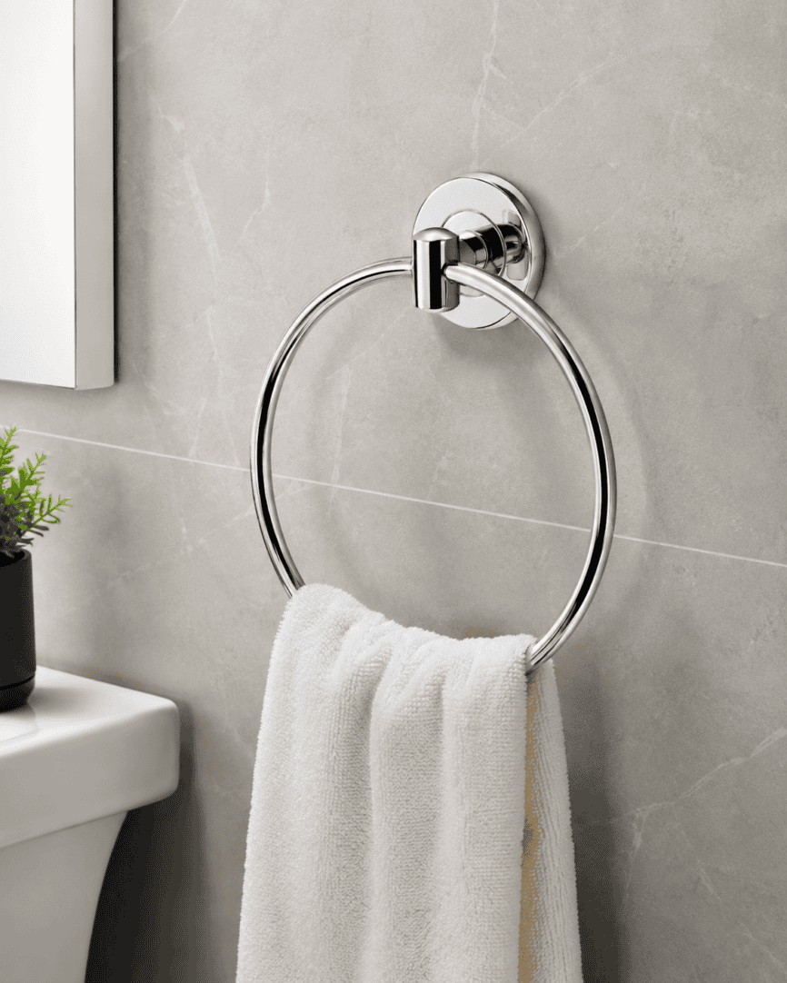 Modern chrome towel ring mounted on a bathroom wall with a white towel.