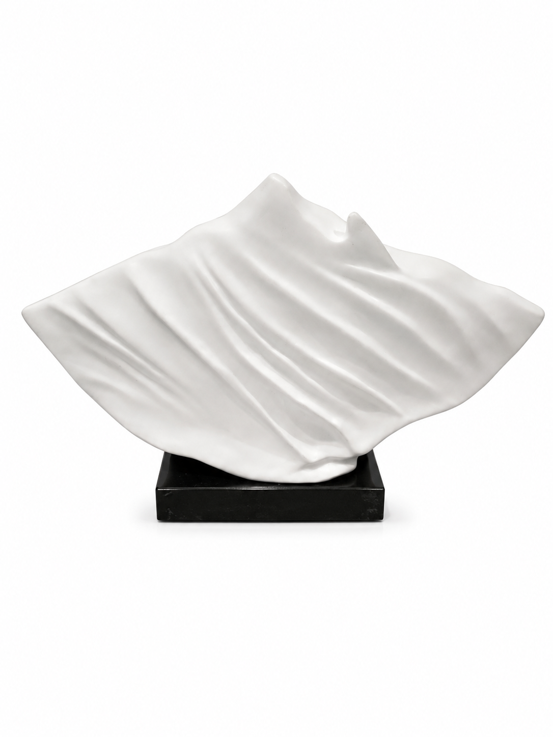 Small White Ornament With Wavy Design On Black Stand